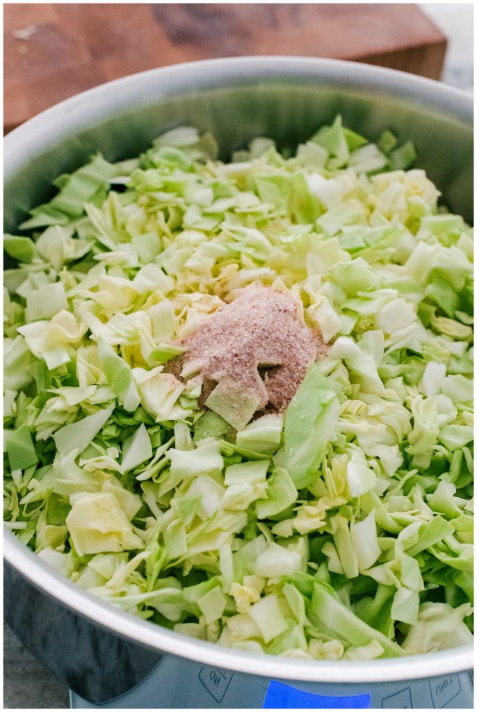 Measuring salt to make sauerkraut