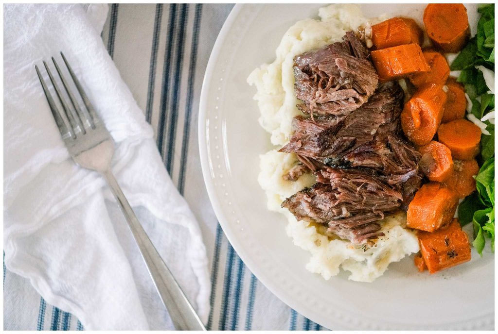 Dutch Oven Post Roast On Plate With Carrots and Mashed Potatoes