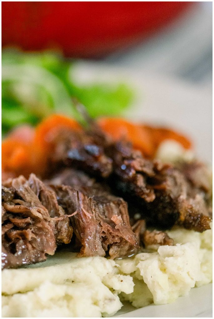 Dutch Oven Post Roast On Plate With Carrots and Mashed Potatoes