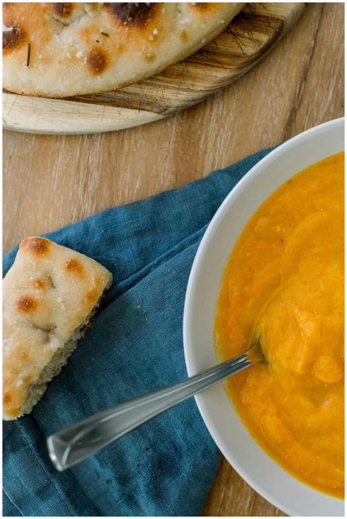 Roasted Butternut Squash Soup In a Bowl With Focaccia