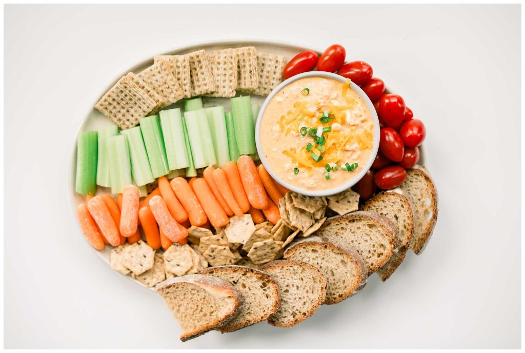 Platter of healthy buffalo Chicken Dip and Veggies